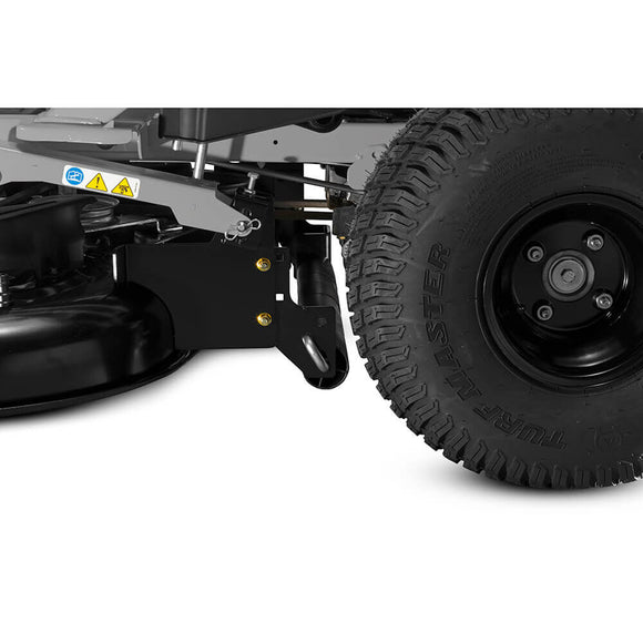 Close-up of a heavy-duty lawn mower's wheel and undercarriage, showcasing durable black tire and mounting features.