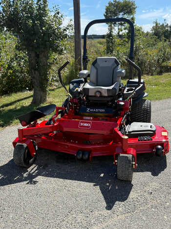 Toro Z Master 72-inch zero-turn mower, red, featuring a comfortable seat and robust Turbo Force cutting deck.