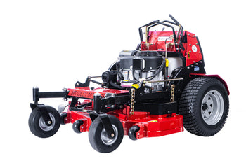 Red commercial lawn mower with powerful engine and large rear wheels for efficient grass cutting.