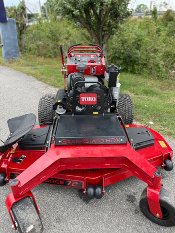 Toro GrandStand HDX 72" zero-turn mower in red, featuring robust design for efficient lawn care.