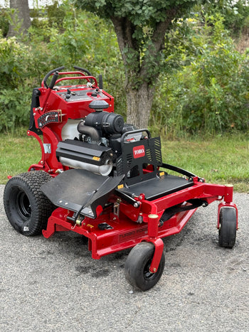 Toro Turbo Force lawn mower, red, featuring reliable engine and durable construction for efficient cutting.